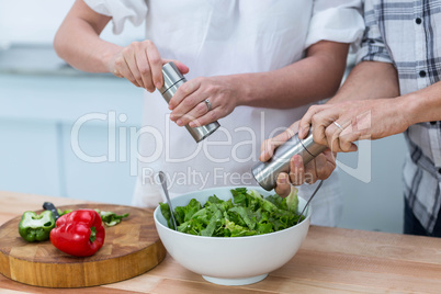 Pregnant couple in kitchen