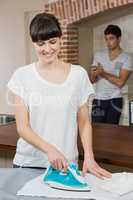 Woman ironing a shirt