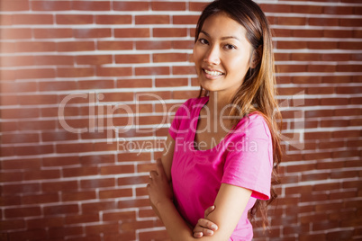 Smiling asian woman crossing arms