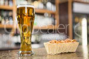 View of a pint of beer and pretzels