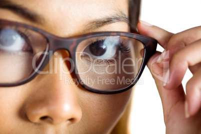 Close up view of a businesswoman holding her eyeglasses