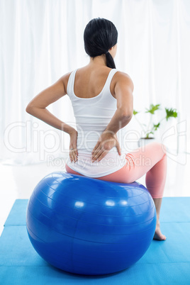 Pregnant woman exercising on exercise ball Pregnant woman exercising on exercise ball