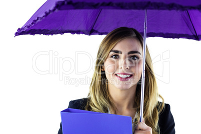 Smiling woman using an umbrella