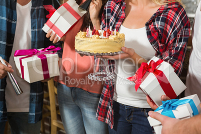 Cute woman celebrating her birthday with a group of friends