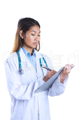 Asian doctor writing on files