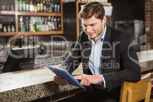 Handsome man using tablet computer