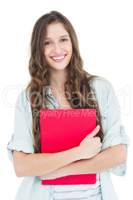Portrait of female student holding books