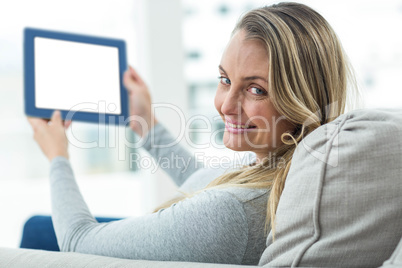 Pregnant woman using digital tablet