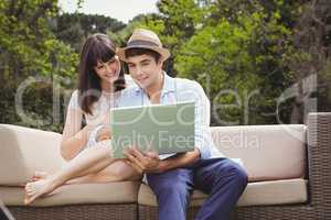 Young couple looking at laptop