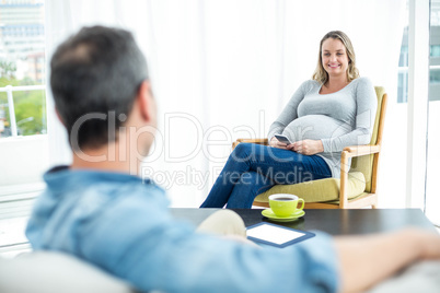 Pregnant woman using smartphone