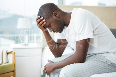 Worried man sitting on sofa