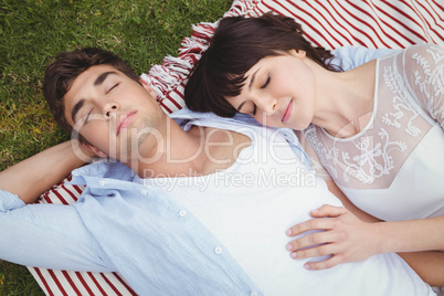 Young couple relaxing on blanket