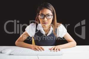 Serious businesswoman using a computer