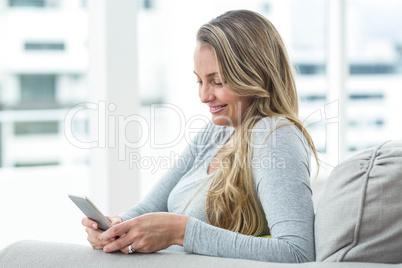 Pregnant woman using smartphone