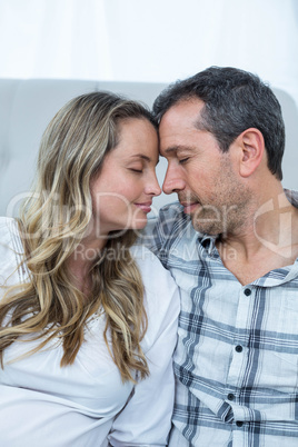 Pregnant couple sitting floor