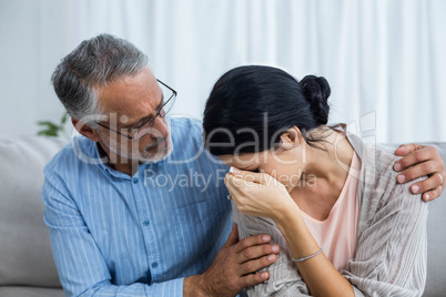 Therapist consoling a woman