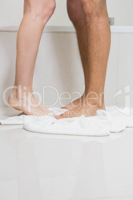 Young couple bathing together in bathtub