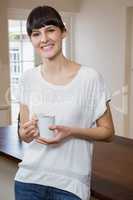 Young woman having a cup of coffee