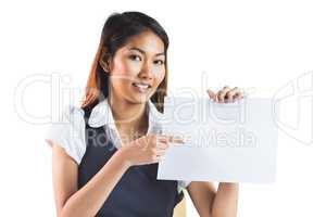 Smiling businesswoman pointing a sheet of paper