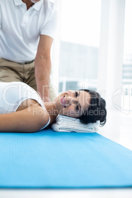 Doctor giving physiotherapy to pregnant woman