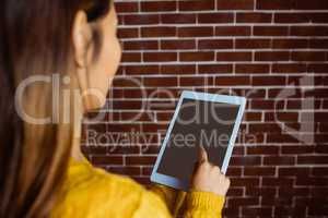 Smiling asian woman using tablet