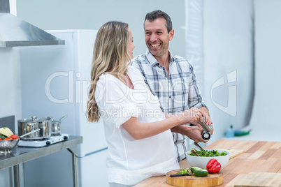 Pregnant couple in kitchen