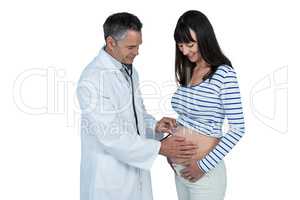 Doctor examining pregnant woman