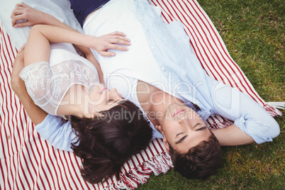 Young couple relaxing on blanket