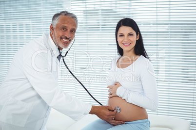 Doctor examining pregnant woman