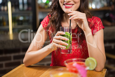 Pretty woman having a cocktail