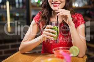 Pretty woman having a cocktail