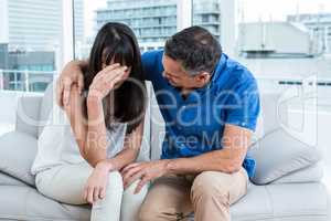 Therapist consoling a woman