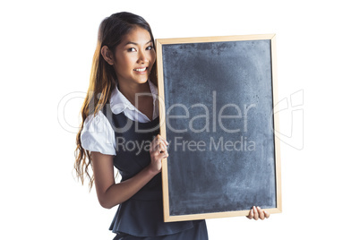 Smiling businesswoman holding a blackboard