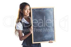 Smiling businesswoman holding a blackboard