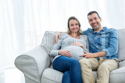 Couple sitting on sofa