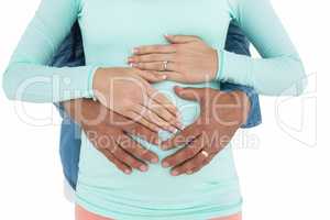 Man holding pregnant womans stomach