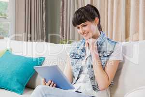 Beautiful young woman using a digital tablet