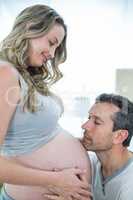 Man holding pregnant womans stomach