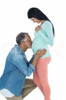 Man kissing pregnant womans stomach