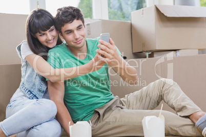 Young couple using mobile phone