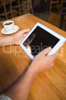 Masculine hands holding tablet