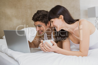 Young couple looking at laptop