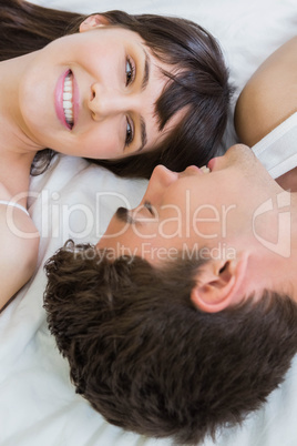 young couple lying on bed