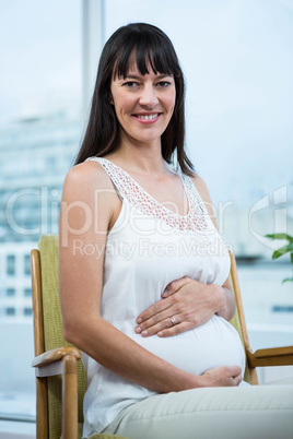 Pregnant woman sitting on chair