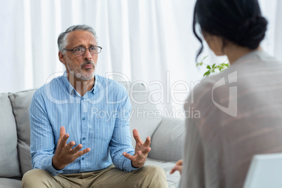 Female doctor consulting a man