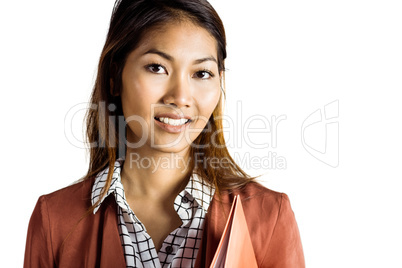 Smiling businesswoman holding a binder