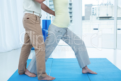 Physiotherapist giving physiotherapy to pregnant woman