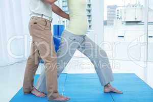 Physiotherapist giving physiotherapy to pregnant woman