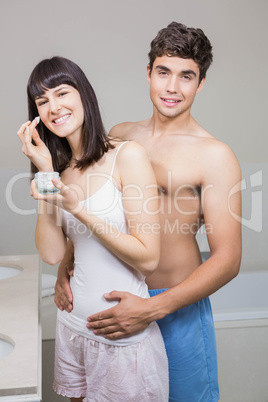 Young couple embracing in bathroom