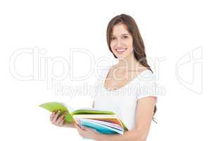 Portrait of happy female college student holding books
